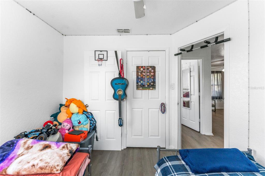 652 North Jackson Street Eagle Lake, FL 33839 - Photo 19 of 30 a room with toys and wooden floor