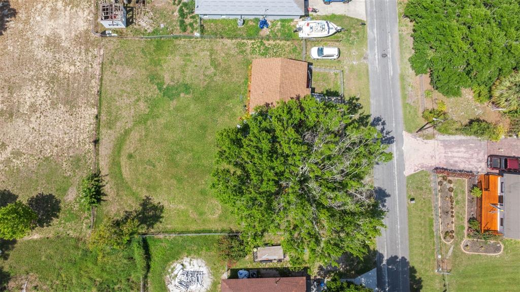 652 North Jackson Street Eagle Lake, FL 33839 - Photo 30 of 30 an aerial view of residential house with outdoor space and swimming pool