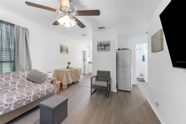 a bedroom with furniture and a window