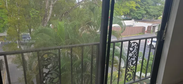 a view of a balcony with wooden floor