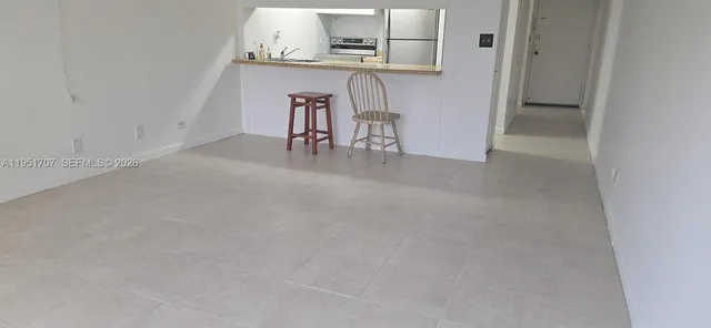 a view of a room that has a window in it