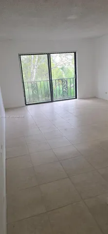a view of kitchen with an empty space