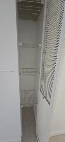 a bathroom with a glass door shower