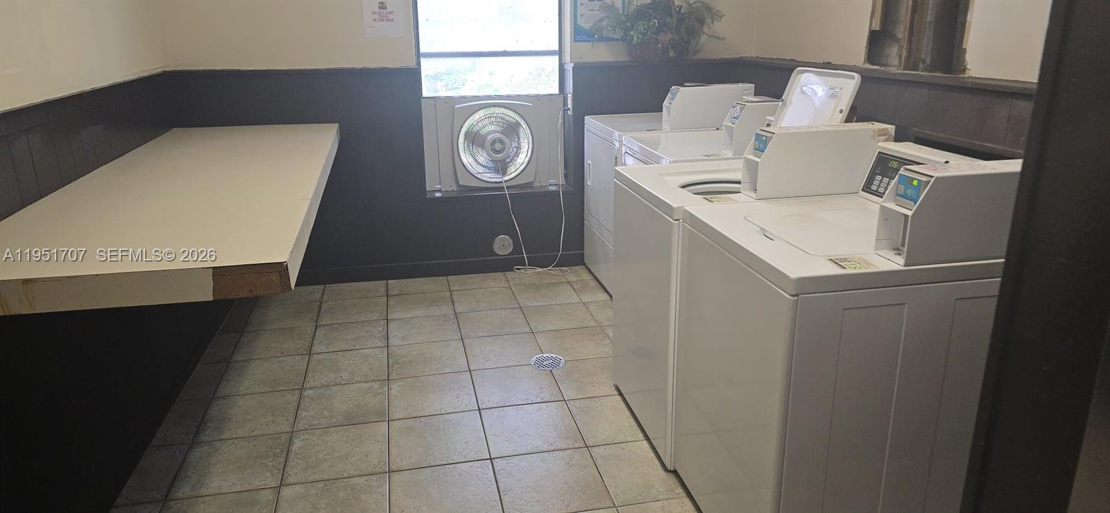 3680 Inverrary Drive, Unit 3M Lauderhill, FL 33319 - Photo 25 of 60 a utility room with dryer and washer