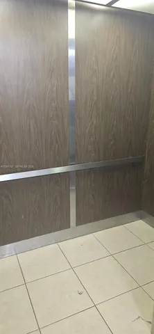 a view of entryway and hall with a window