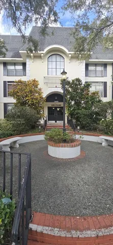 a lobby with furniture and a mirror