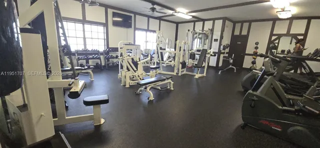 a view of a lake with a table and chairs