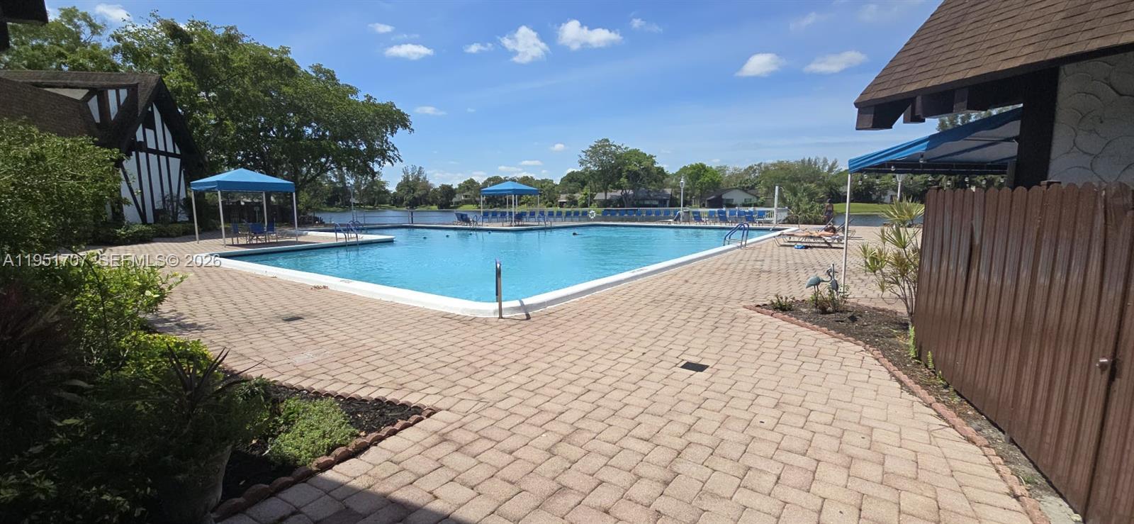 3680 Inverrary Drive, Unit 3M Lauderhill, FL 33319 - Photo 40 of 60 a view of a swimming pool with a patio