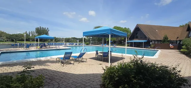 a bathroom with a sink a mirror and shower
