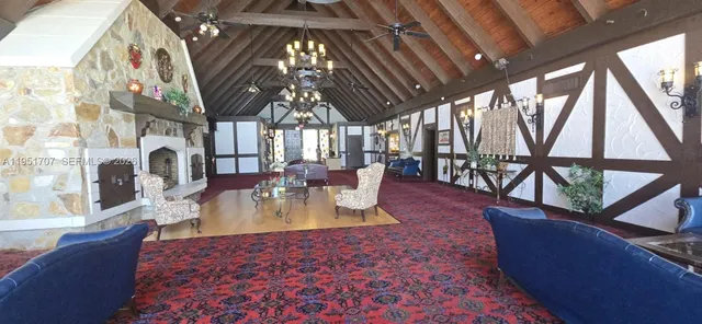 a view of a house with a yard patio and sitting area