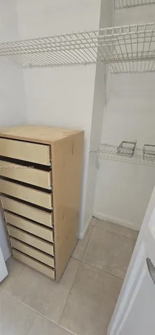 a view of a room with racks on the wall