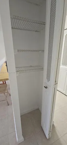 a view of a kitchen with a sink cabinets and a window