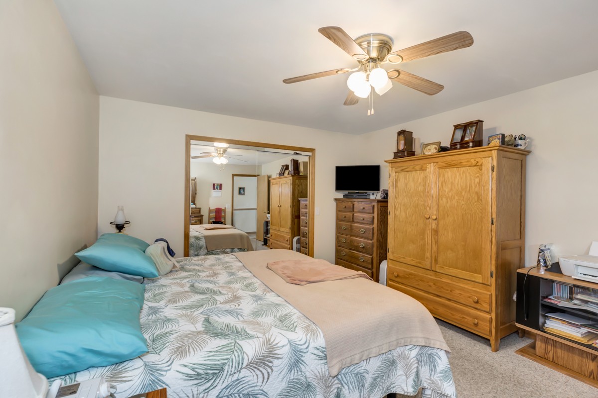 1997 Nancy Green Ridge Road Prospect, TN 38477 - Photo 13 of 25 a bedroom with a bed and dresser with mirror