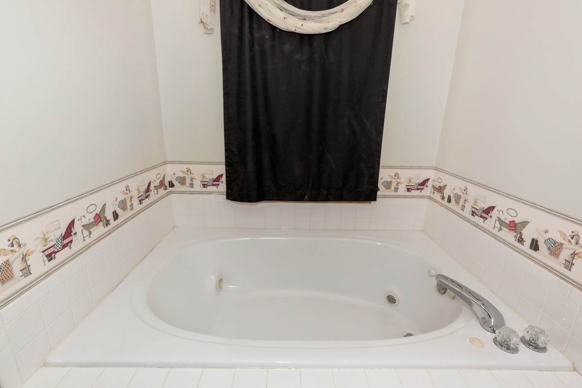 1997 Nancy Green Ridge Road Prospect, TN 38477 - Photo 16 of 25 a bathroom with a bathtub and a sink
