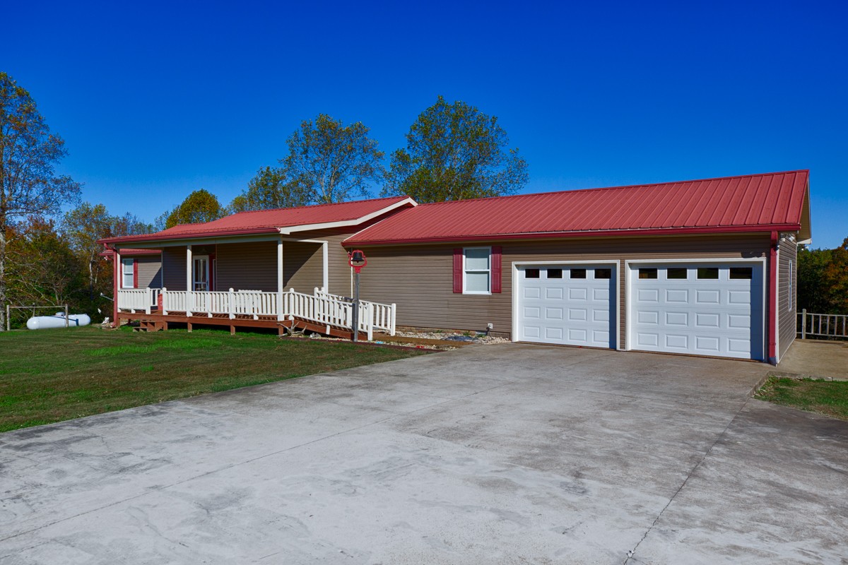 1997 Nancy Green Ridge Road Prospect, TN 38477 - Photo 23 of 25 a front view of a house with a garden