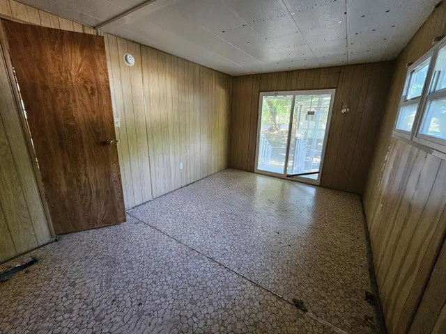 a view of hallway with a large window
