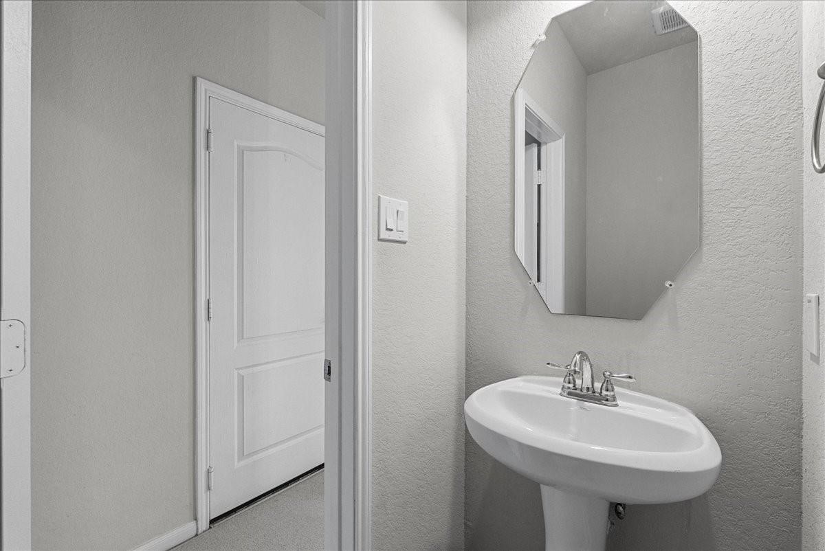 5111 Bay Lane Bacliff, TX 77518 - Photo 24 of 37 a bathroom with a sink and a mirror