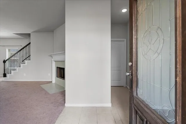 a view of entryway with furniture and wooden floor