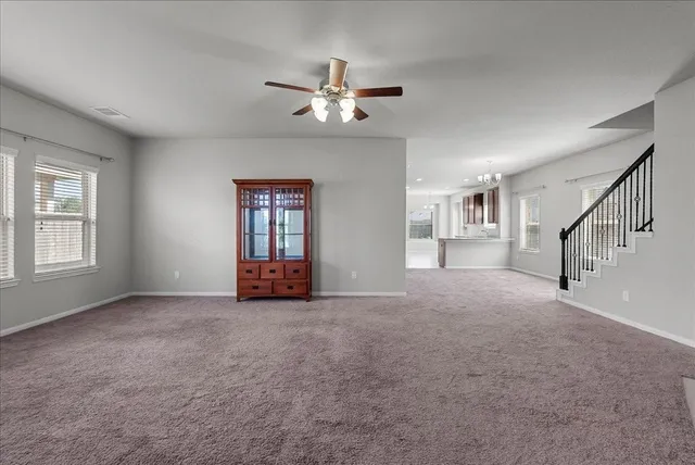 a view of empty room with windows