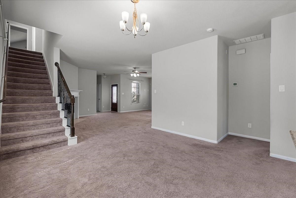 5111 Bay Lane Bacliff, TX 77518 - Photo 8 of 37 a view of a livingroom with wooden floor and stairs