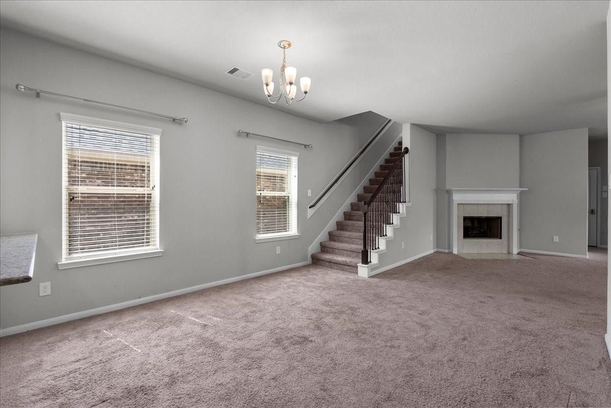5111 Bay Lane Bacliff, TX 77518 - Photo 10 of 37 a view of an empty room with a fireplace and a window
