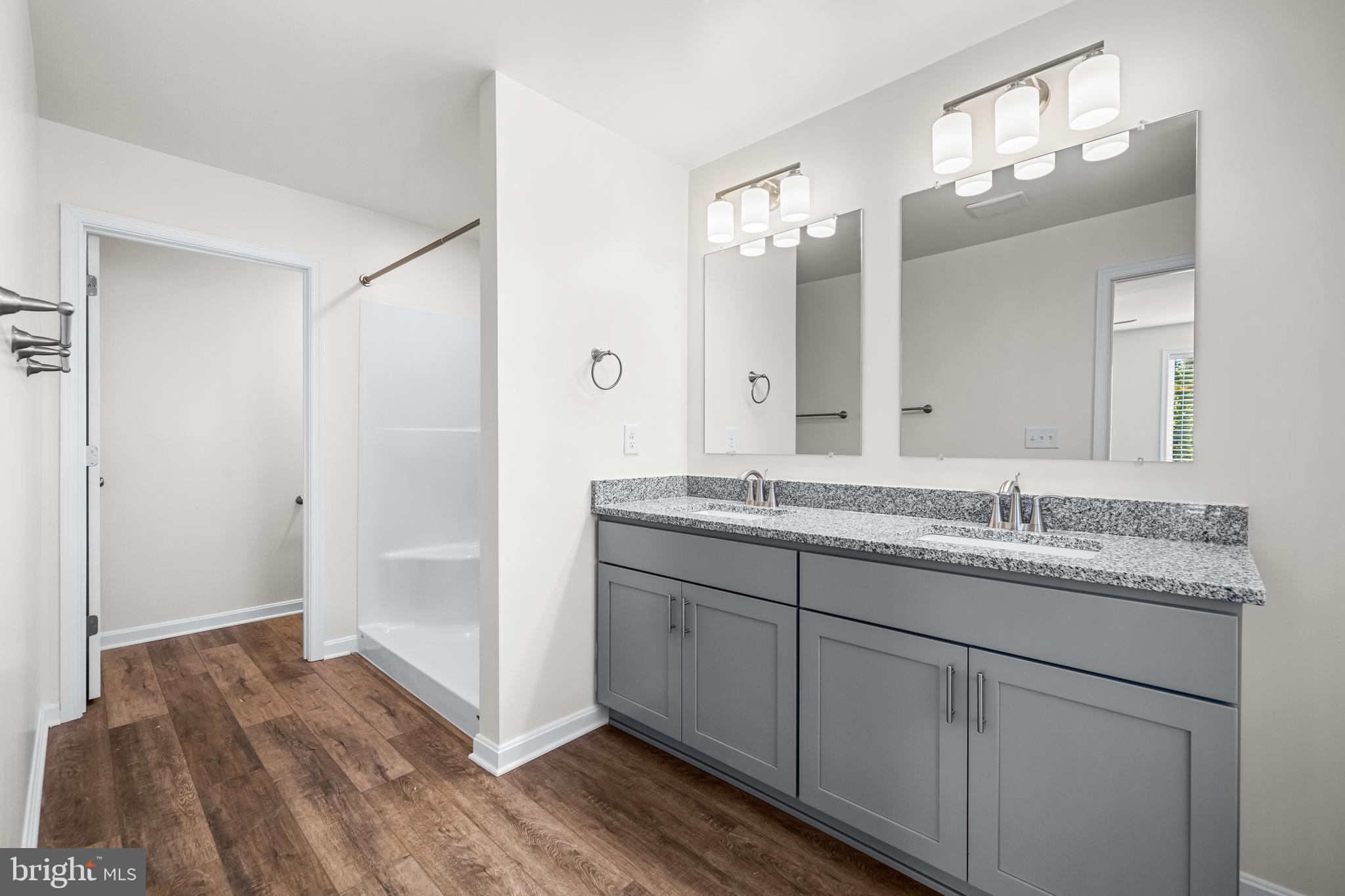 900 Gilbert Road, Unit 3622A Aberdeen, MD 21001 - Photo 17 of 23 a bathroom with a granite countertop double vanity sink and mirror