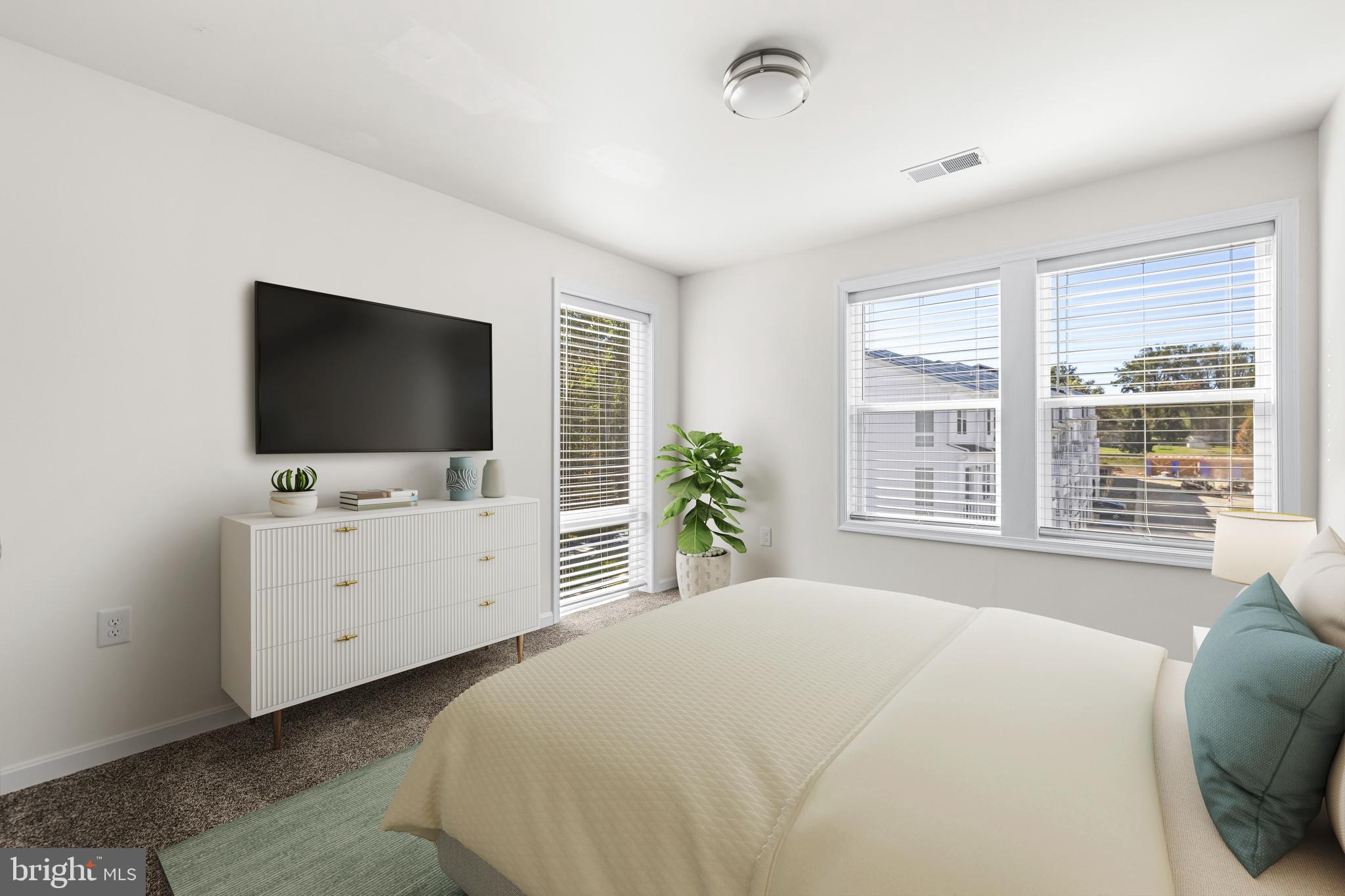 900 Gilbert Road, Unit 3622A Aberdeen, MD 21001 - Photo 19 of 23 a bedroom with a bed and a flat screen tv