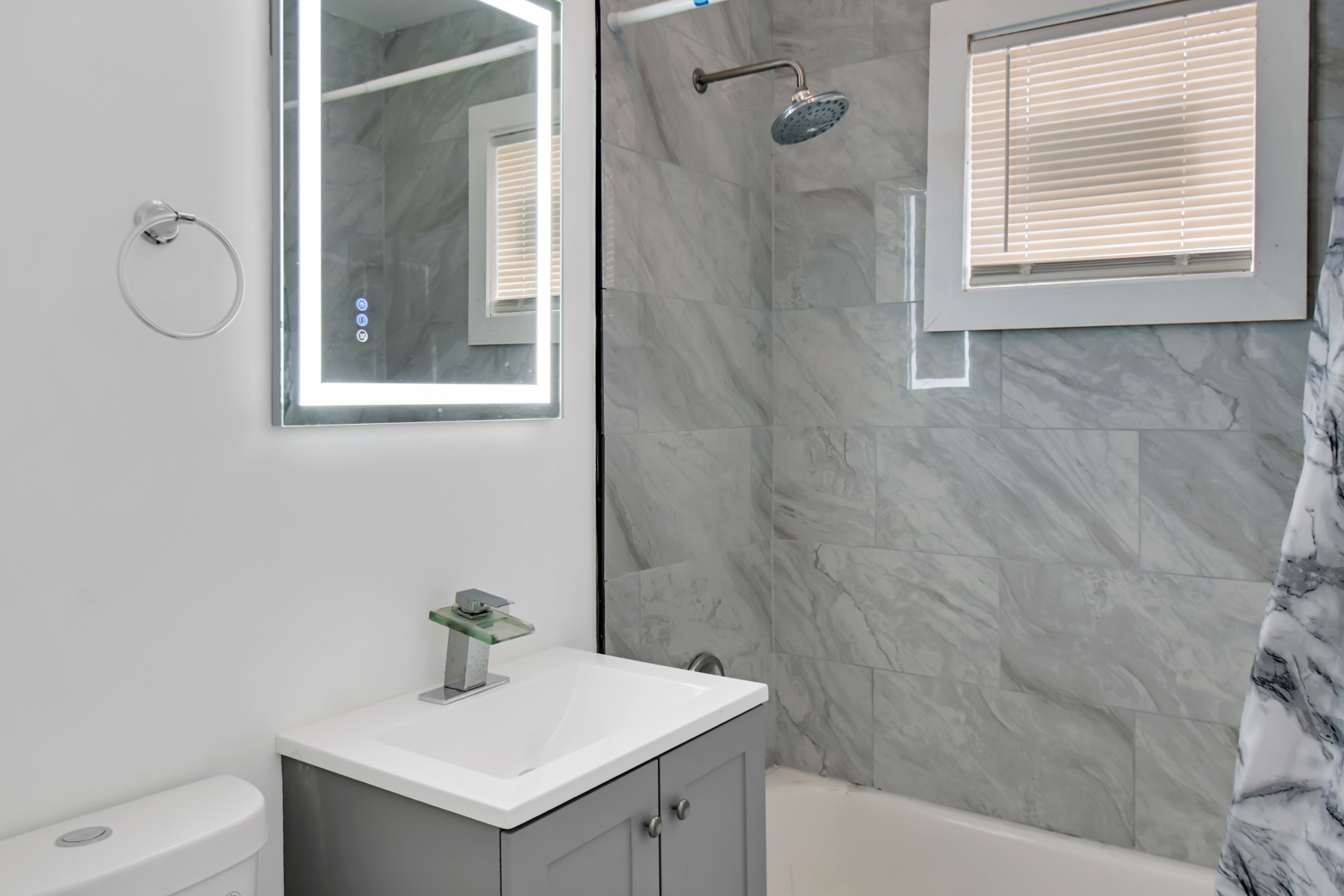 1011 West 103rd Place Chicago, IL 60643 - Photo 7 of 22 a bathroom with a tub sink and mirror