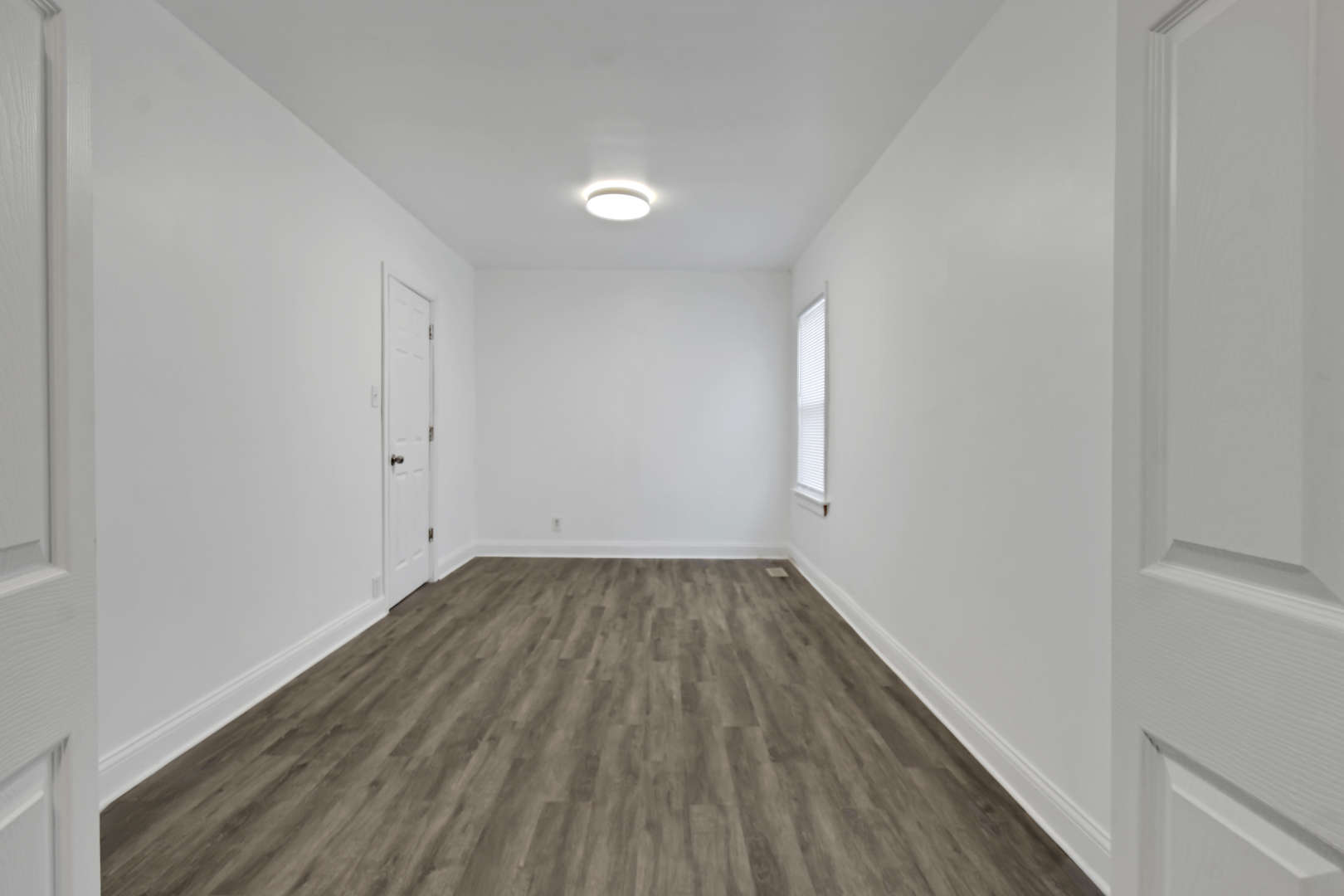 1011 West 103rd Place Chicago, IL 60643 - Photo 10 of 22 a view of a room with wooden floor and white walls