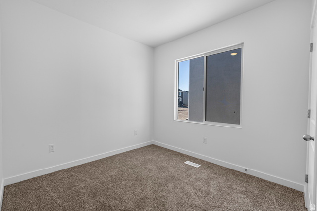 2823 North 710 West, Unit 16 Logan, UT 84321 - Photo 7 of 22 Spare room with baseboards and dark colored carpet