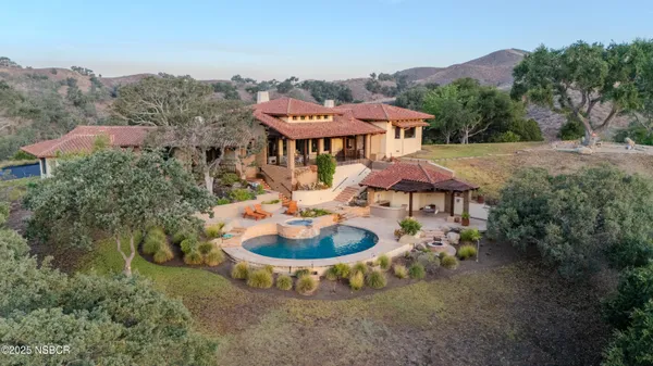 a swimming pool with outdoor seating yard and barbeque oven