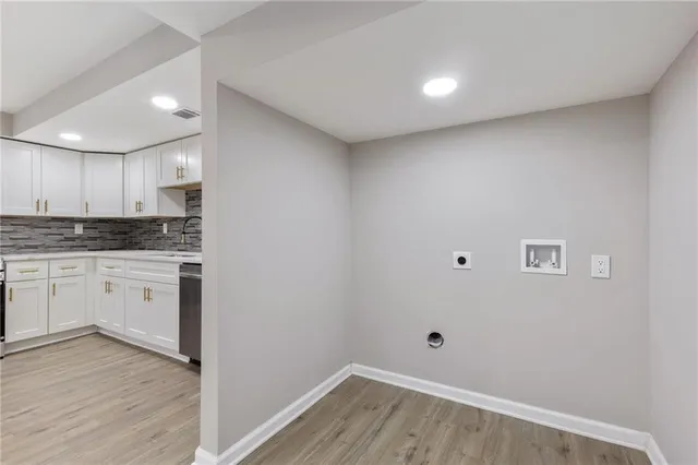 a kitchen with a refrigerator and window