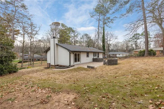 a view of a house with a snow in the yard