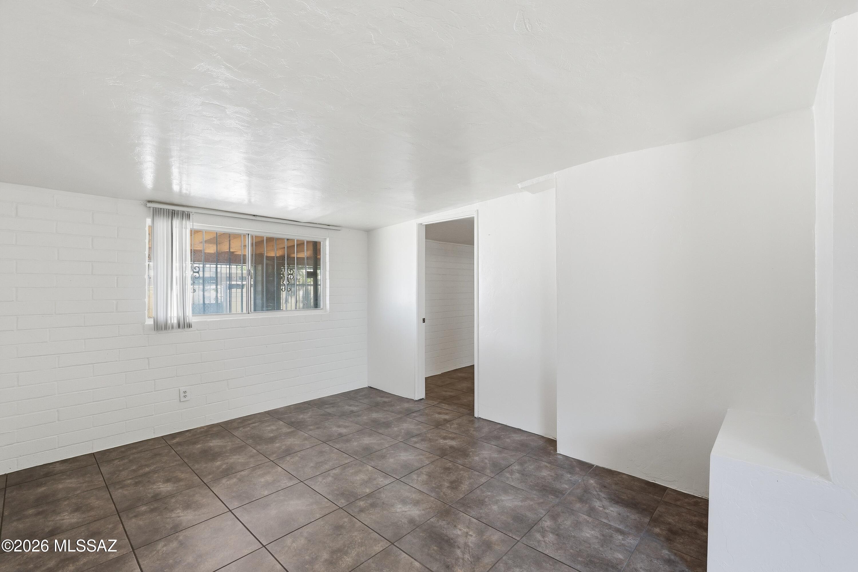 1808 West Caravelle Road Tucson, AZ 85713 - Photo 25 of 38 a view of an empty room with a window