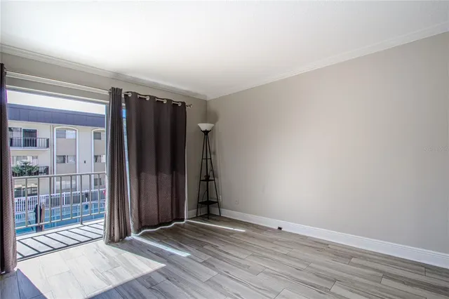 an empty room with wooden floor