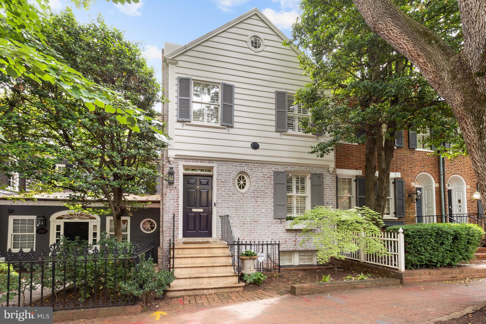 3334 Reservoir Road Northwest Washington, DC 20007 - Photo 2 of 5 a front view of a house with a garden