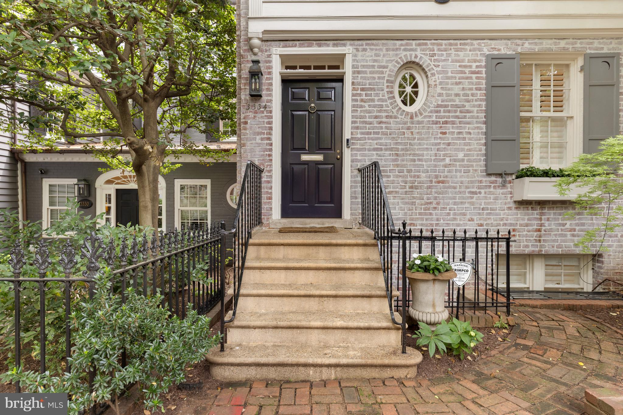 3334 Reservoir Road Northwest Washington, DC 20007 - Photo 3 of 5 a front view of a house with stairs