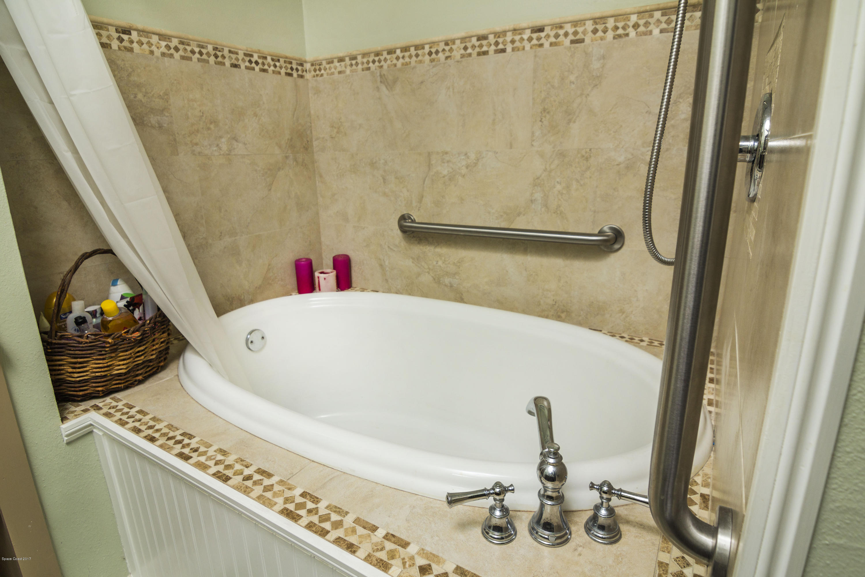 905 Riviera Drive Northeast Palm Bay, FL 32905 - Photo 15 of 21 a bathroom with a sink and a shower