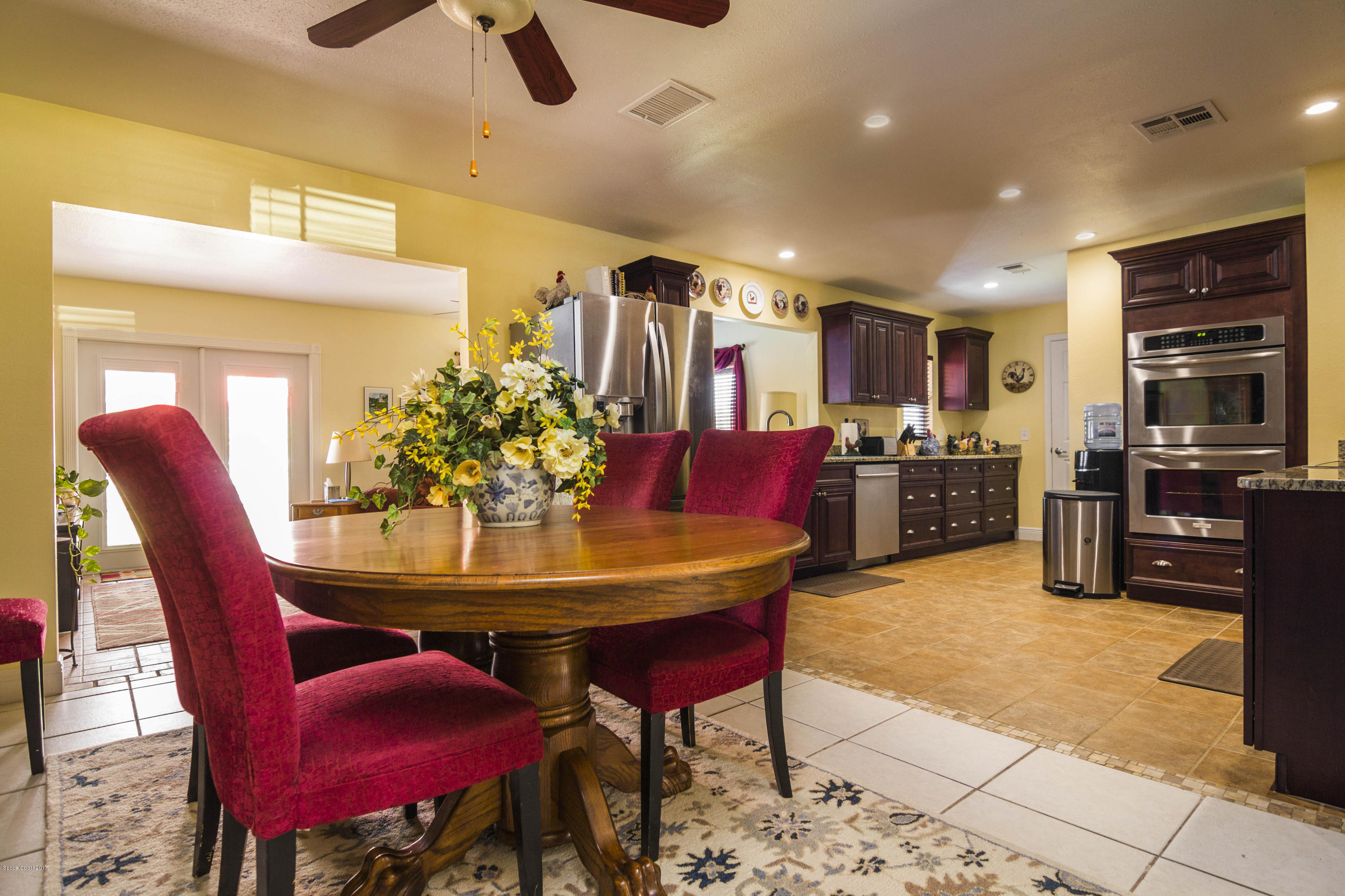 905 Riviera Drive Northeast Palm Bay, FL 32905 - Photo 4 of 21 a view of a dining room with furniture