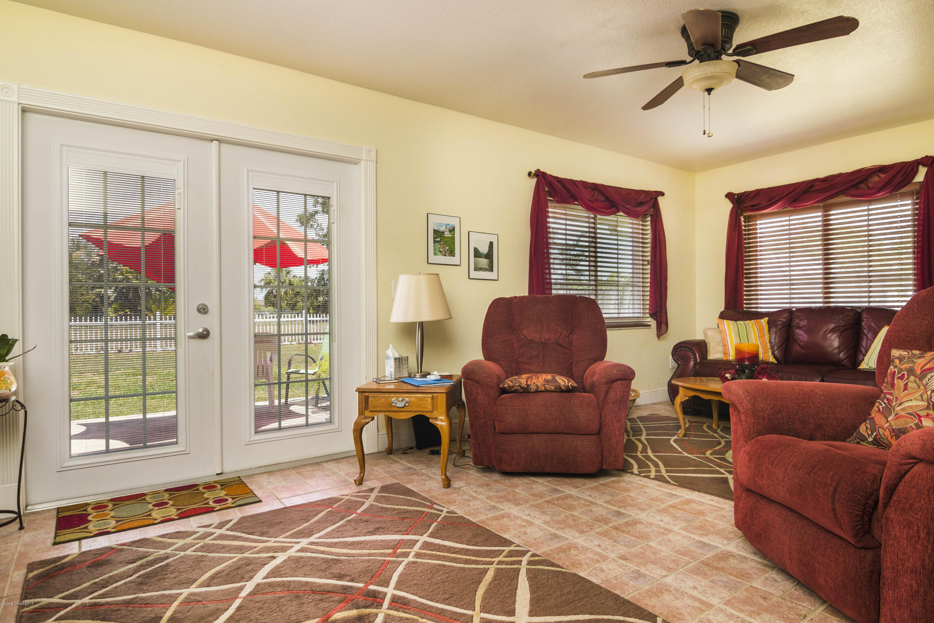 905 Riviera Drive Northeast Palm Bay, FL 32905 - Photo 8 of 21 a living room with furniture and a window