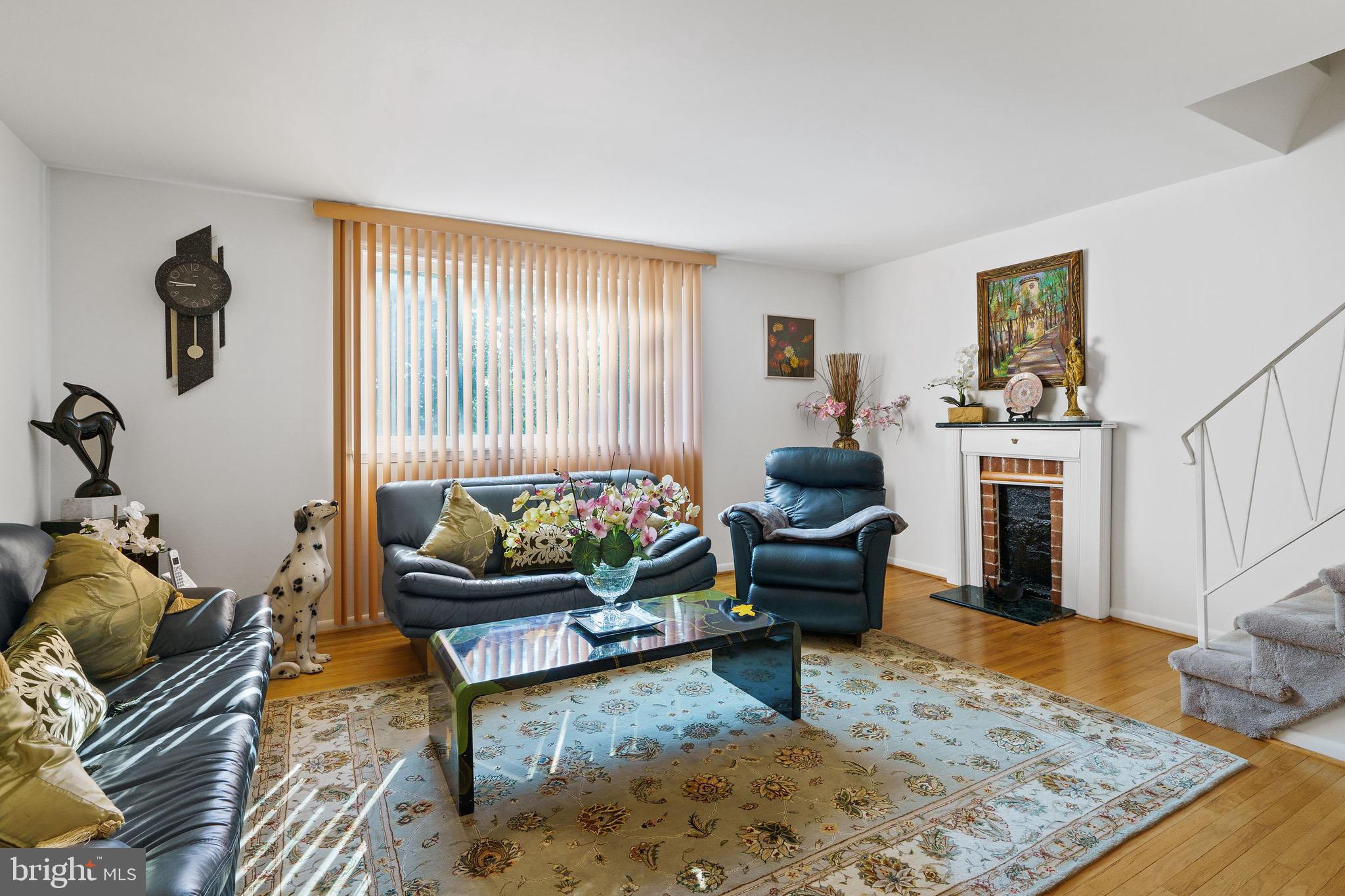 1122 Surrey Road Philadelphia, PA 19115 - Photo 11 of 29 a living room with furniture and a fireplace