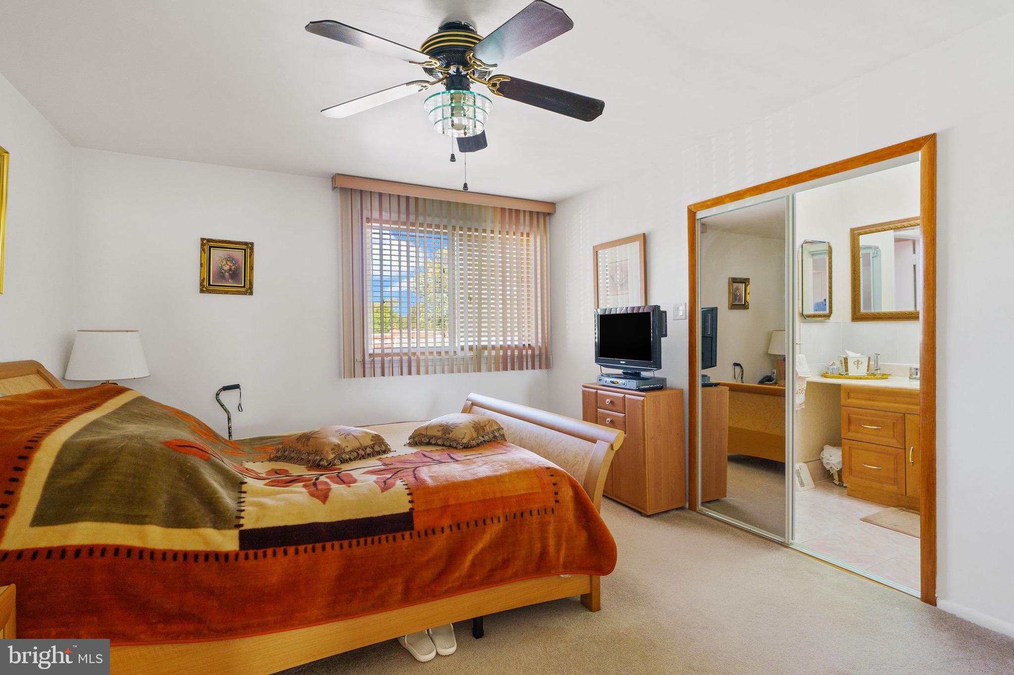 1122 Surrey Road Philadelphia, PA 19115 - Photo 17 of 29 a bedroom with a bed and a couch