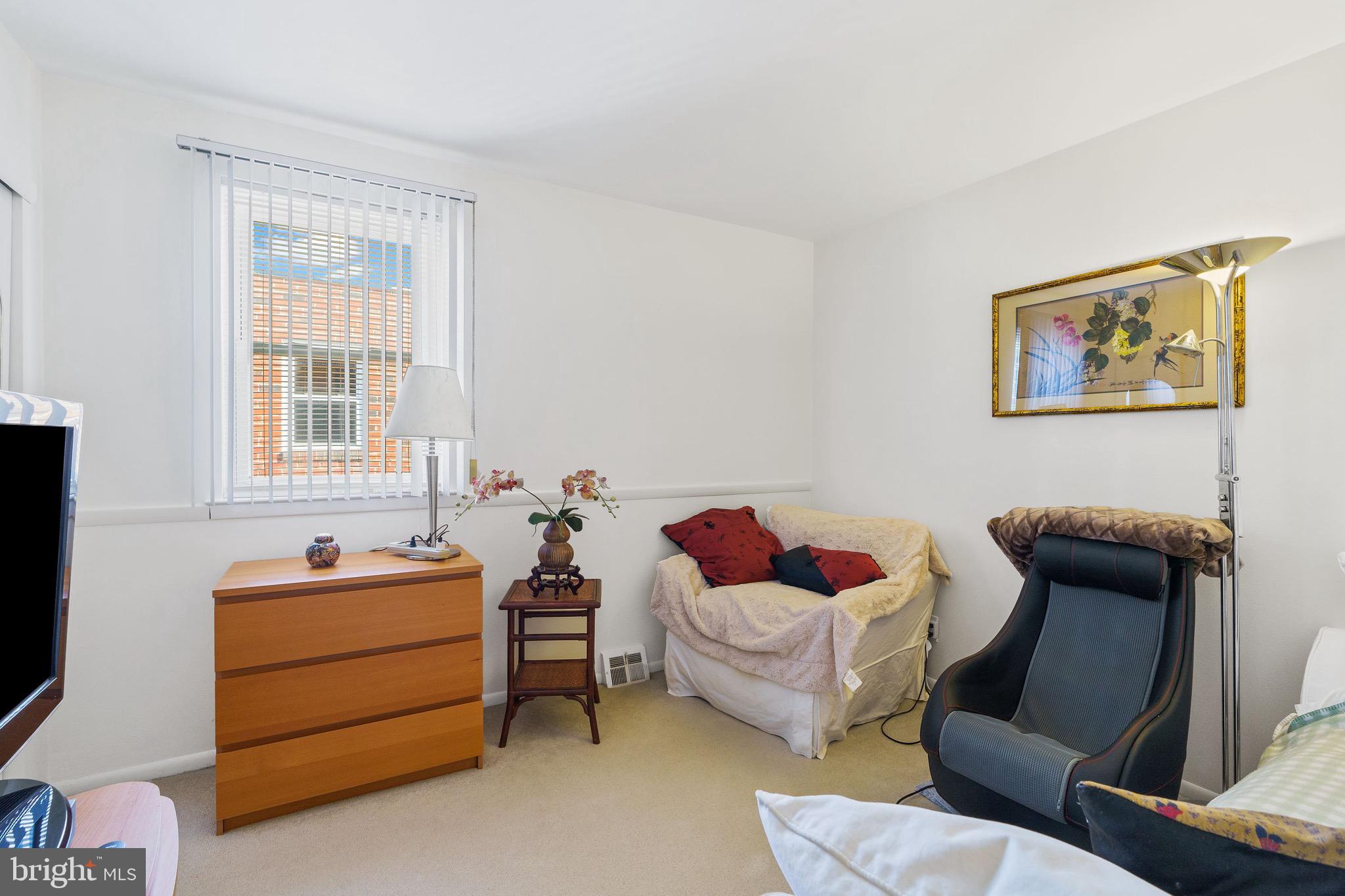 1122 Surrey Road Philadelphia, PA 19115 - Photo 23 of 29 a room with furniture and a window