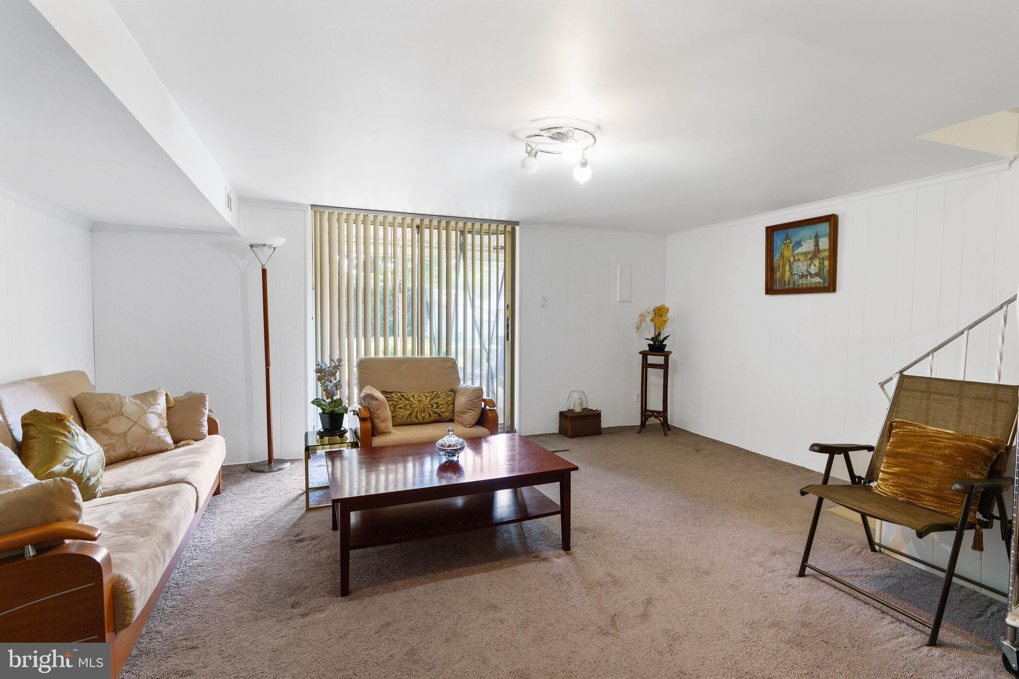 1122 Surrey Road Philadelphia, PA 19115 - Photo 27 of 29 a living room with furniture and a window