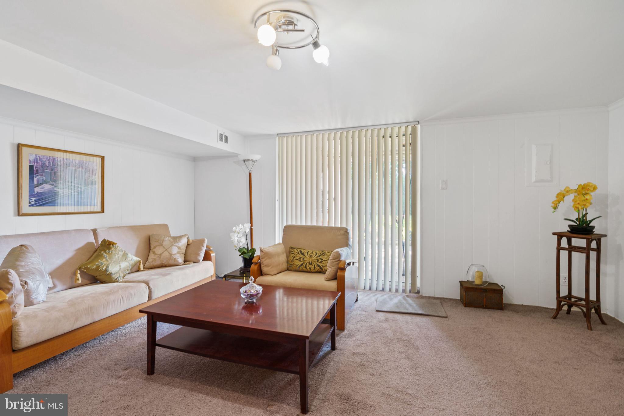 1122 Surrey Road Philadelphia, PA 19115 - Photo 28 of 29 a living room with furniture and a window
