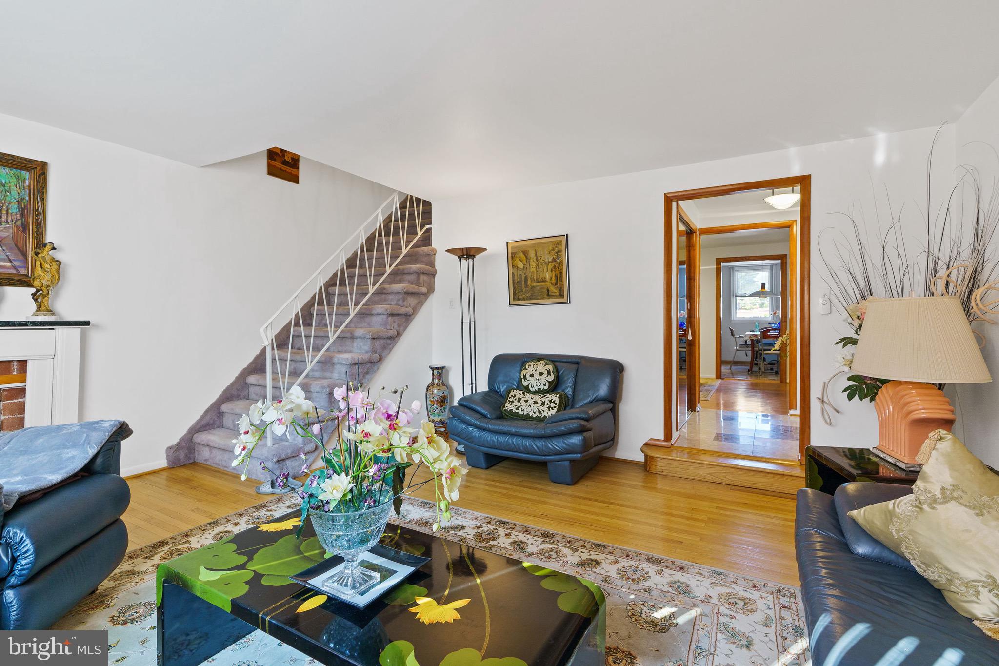 1122 Surrey Road Philadelphia, PA 19115 - Photo 8 of 29 a living room with furniture and a fireplace