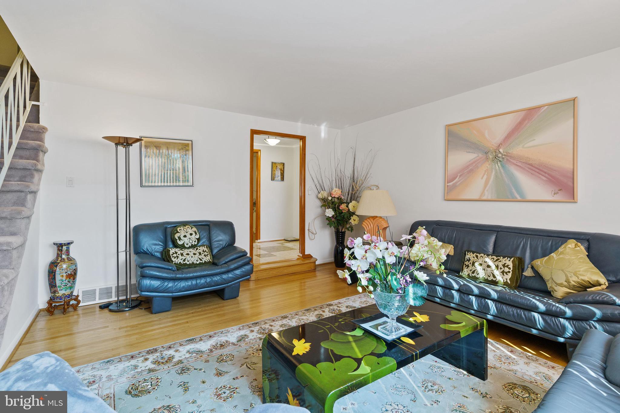 1122 Surrey Road Philadelphia, PA 19115 - Photo 9 of 29 a living room with furniture and a wooden floor