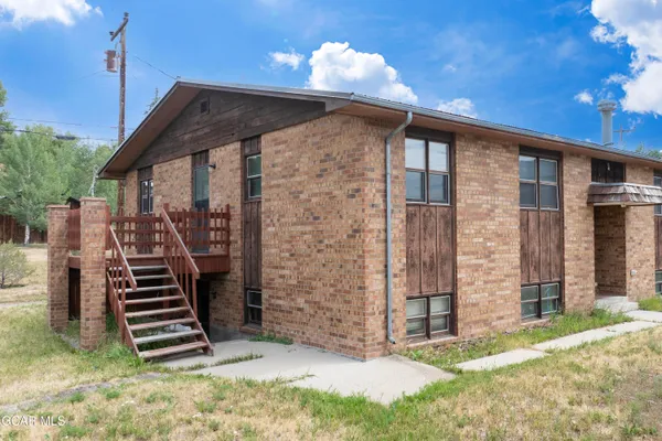 a front view of a house with stairs
