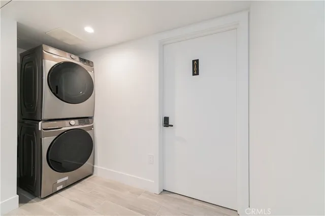 a view of a hallway with washer and dryer