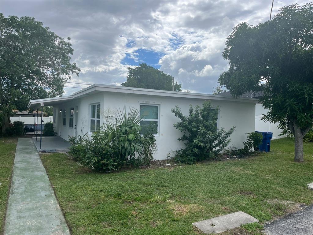 1457 West 31st Street, Unit 2 Riviera Beach, FL 33404 - Photo 2 of 16 a view of a house with backyard and garden